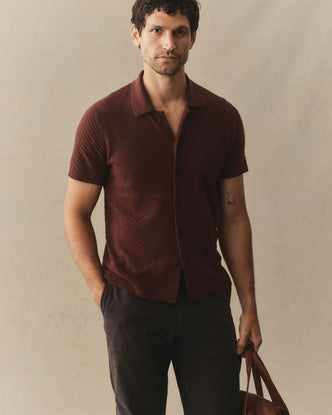 fit model posing in The Arlo Sweater Polo in Burgundy Texture Knit