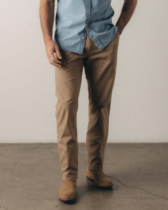 fit model posing in The Democratic Foundation Pant in Organic Khaki
