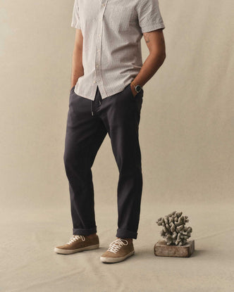 fit model posing in The Roamer Pant in Navy Broken Twill
