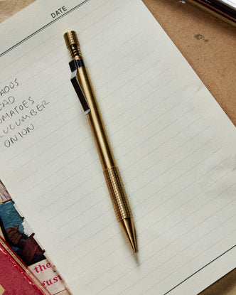 editorial image of The Mechanical Pencil in Brass on a sheet of paper