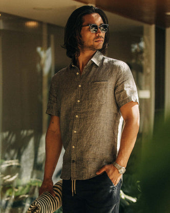 fit model holding a towel wearing The Short Sleeve California in Navy Hemp