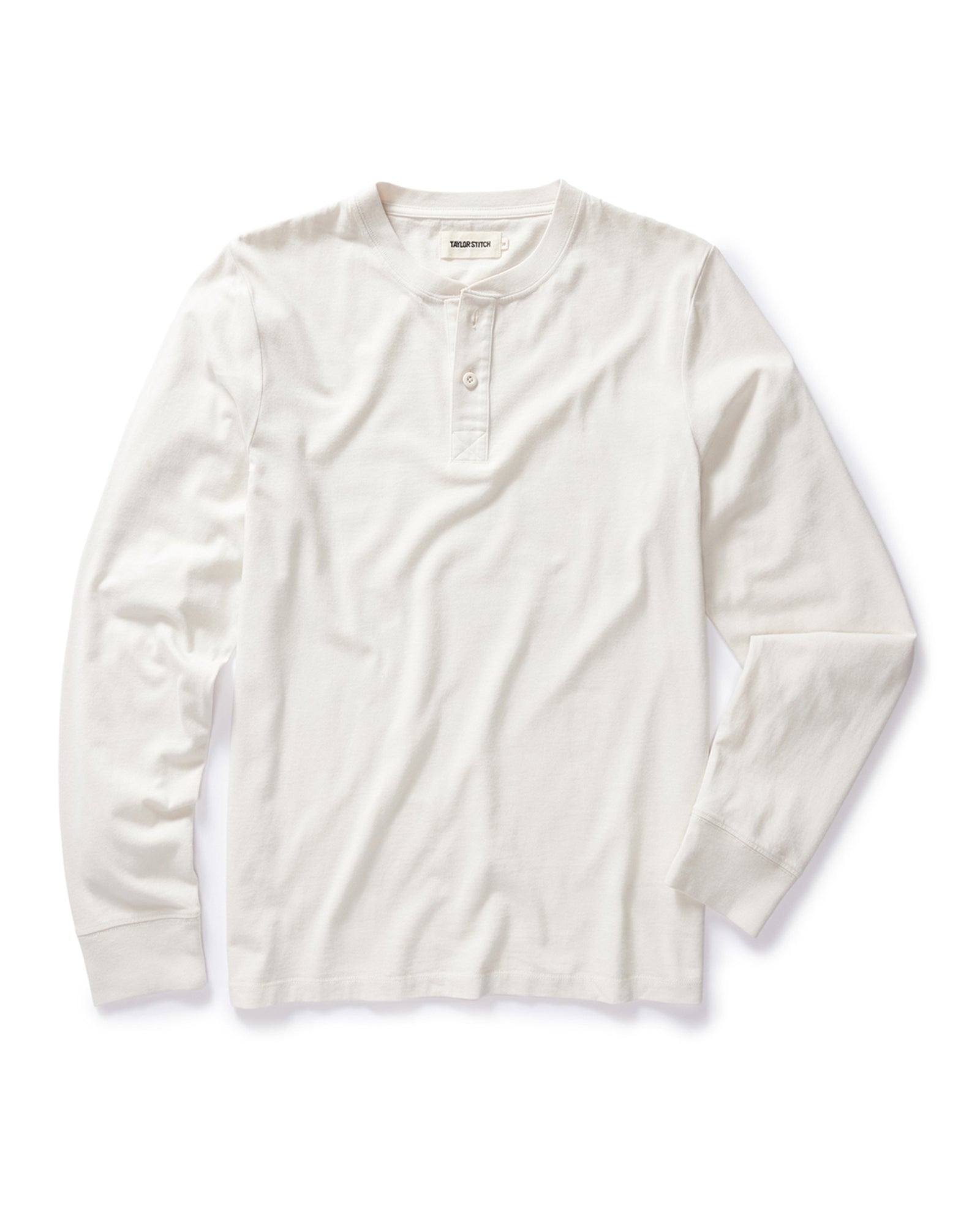 flatlay of The Organic Cotton Henley in Vintage White, Knits by Taylor Stitch