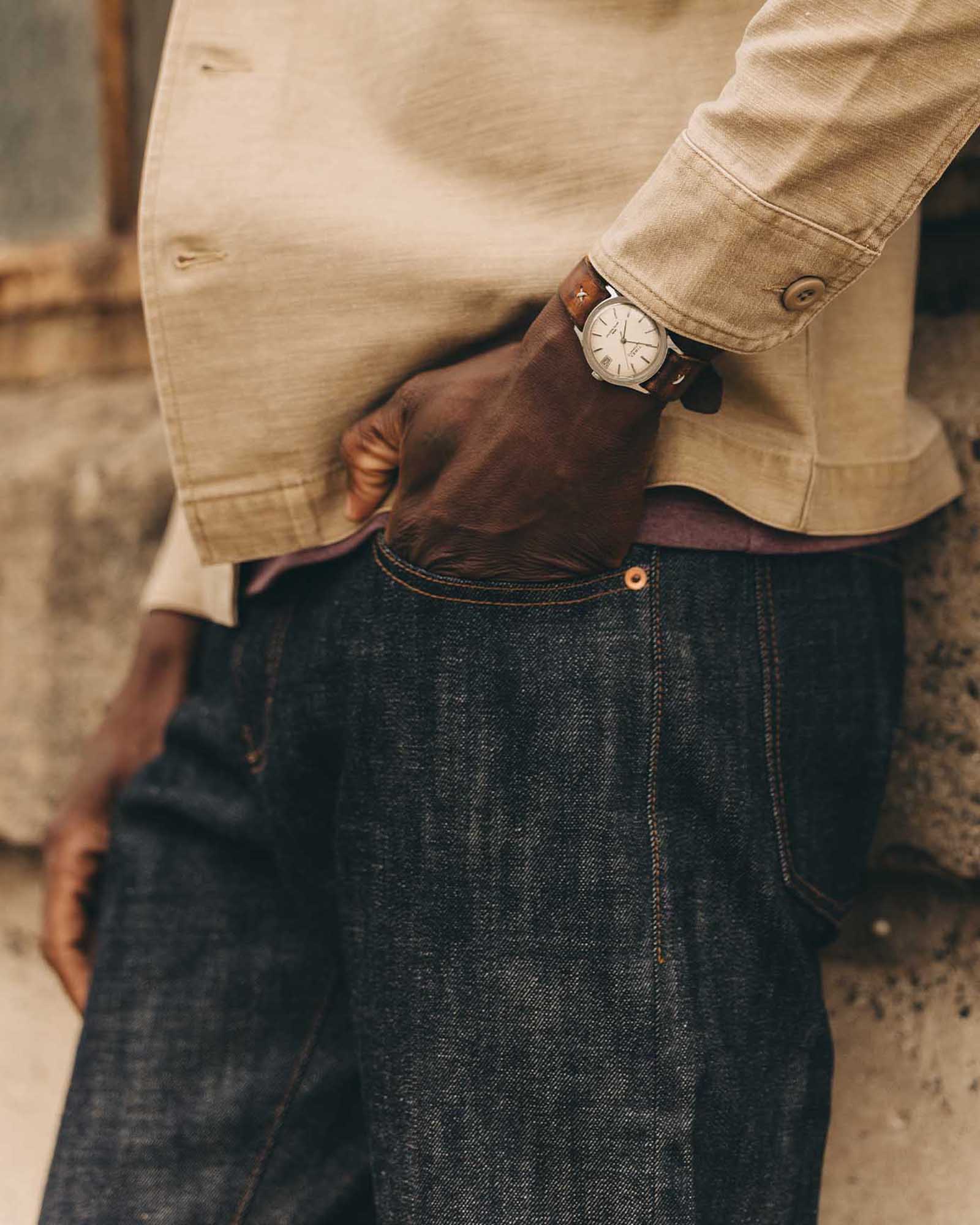 fit model walking wearing The Democratic Jean in Rigid Organic Selvedge, Bottoms by Taylor Stitch
