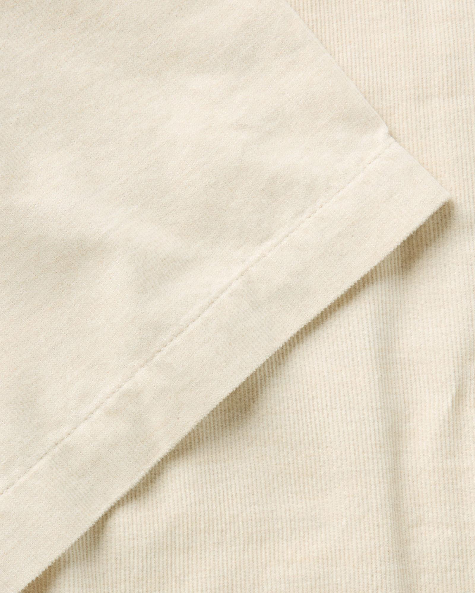 material shot of the sleeve on The Conrad Shirt in Heather Oat Pincord, Wovens by Taylor Stitch