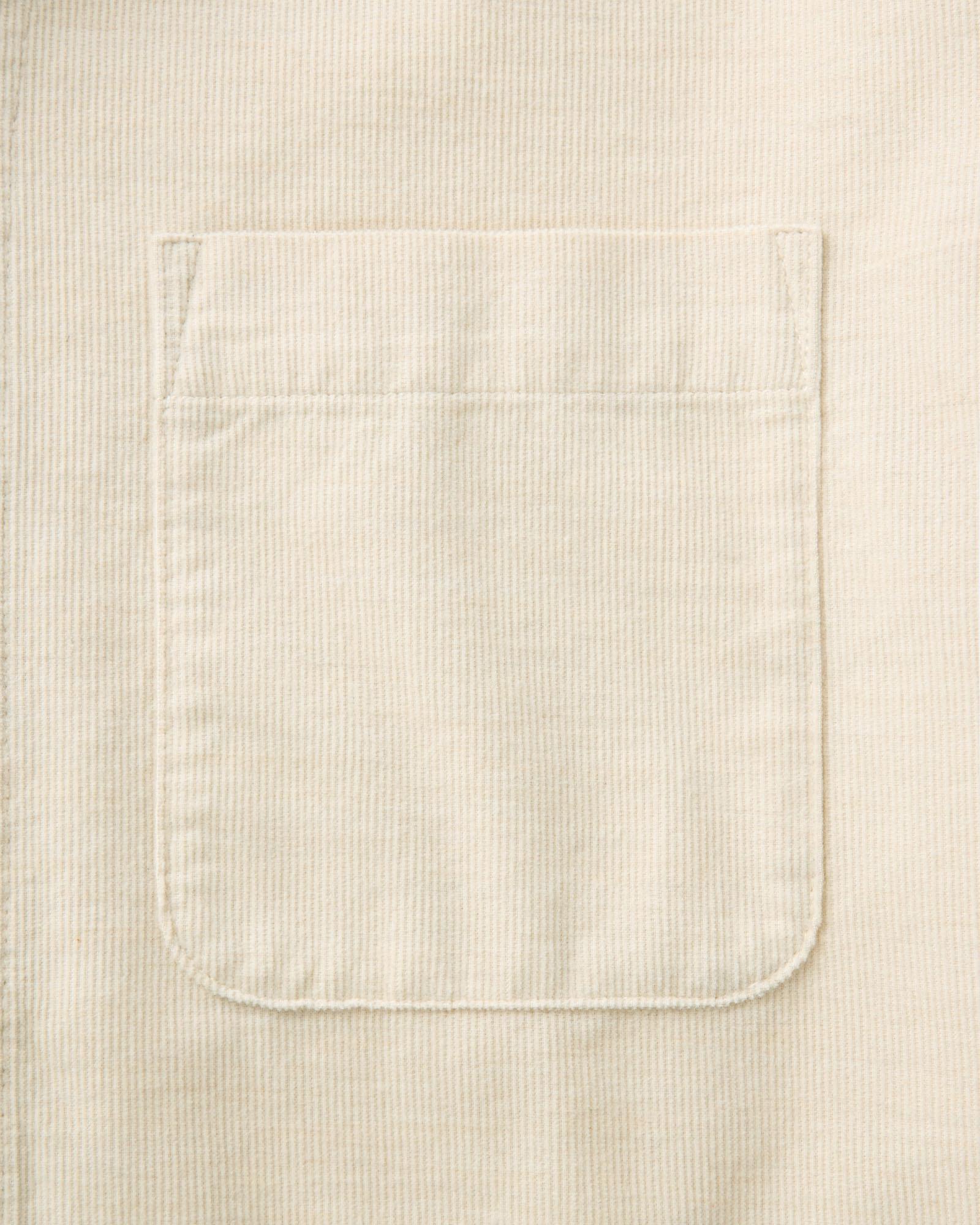 material shot of the pocket on The Conrad Shirt in Heather Oat Pincord, Wovens by Taylor Stitch