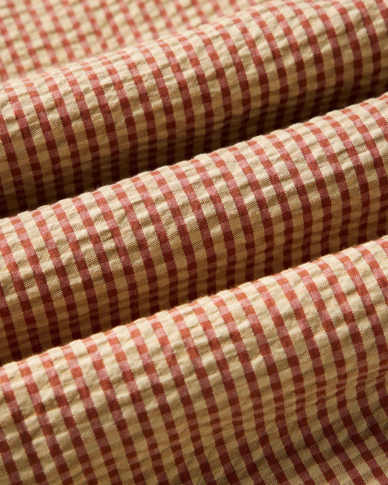 material shot of the fabric on The Short Sleeve Jack in Brick Check Seersucker, Wovens by Taylor Stitch