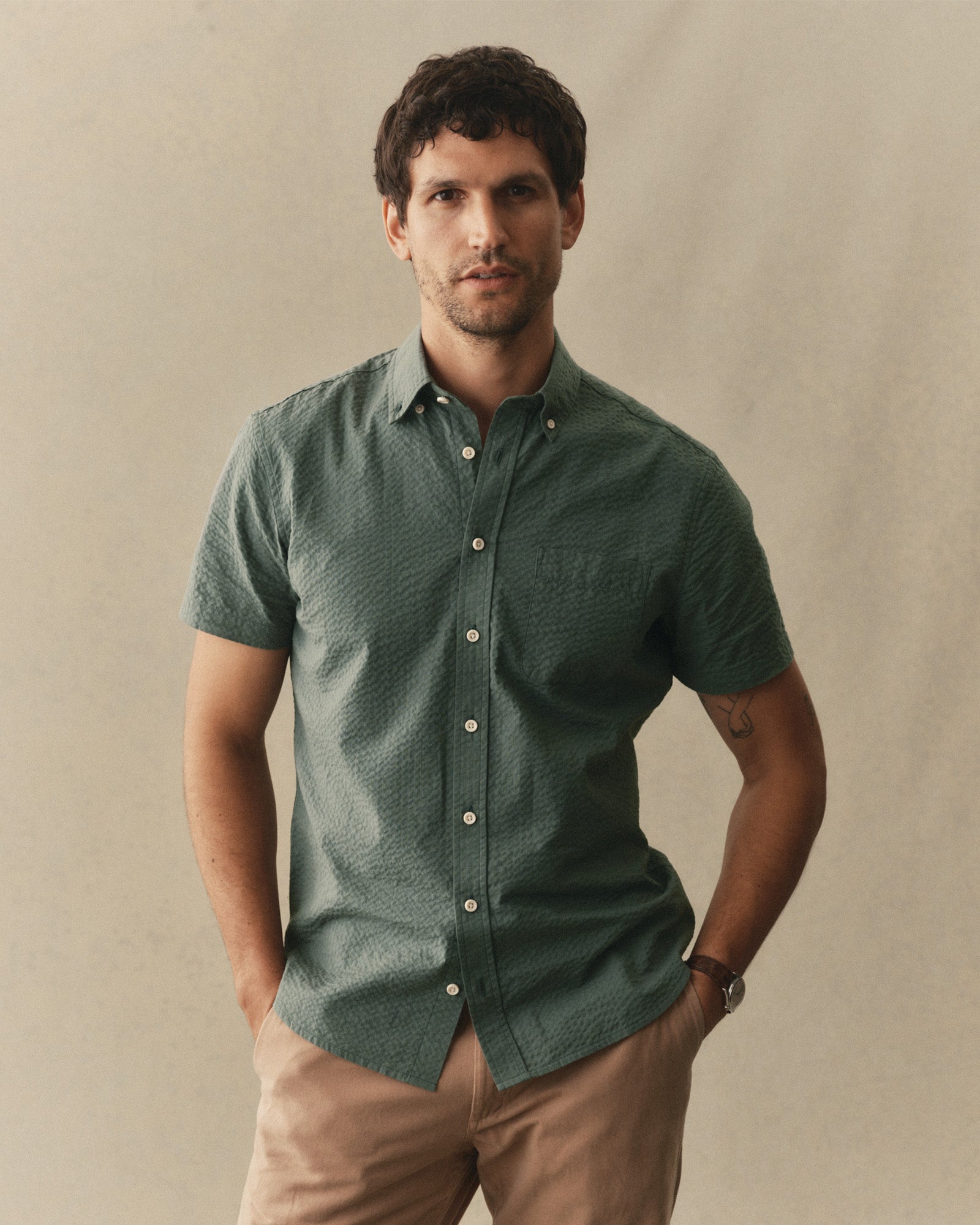 fit model showing off The Short Sleeve Jack in Deep Sea Seersucker, Wovens by Taylor Stitch