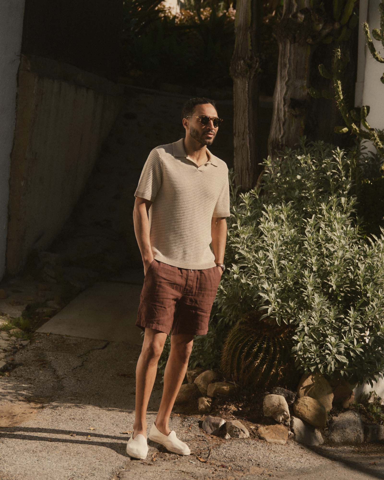 fit model showing off The Valencia Sweater Polo in Sand Stripe, Knits by Taylor Stitch