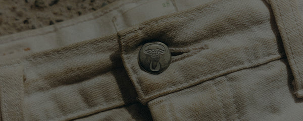 editorial image of the waistband on Good Acre Chore Pants