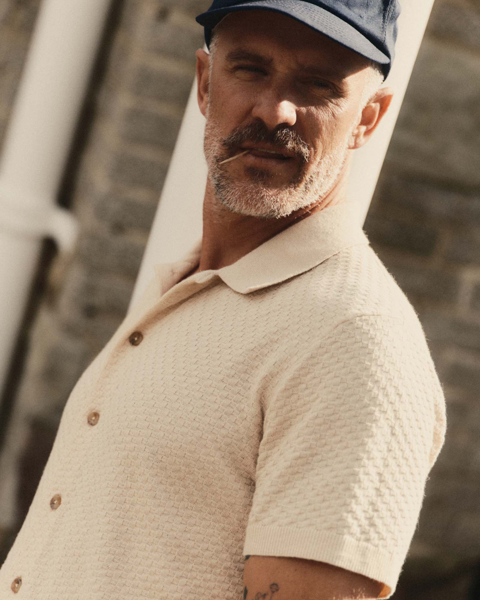 fit model showing off The Arlo Sweater Polo in Oat Texture Knit, Knits by Taylor Stitch