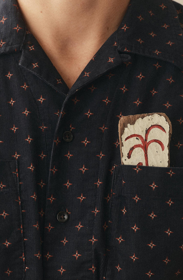 fit model showing off the pocket on The Conrad Shirt in Navy Pigeon Foulard Pincord