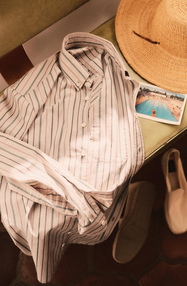 editorial flatlay of The Jack in Algiers Stripe next to a hat