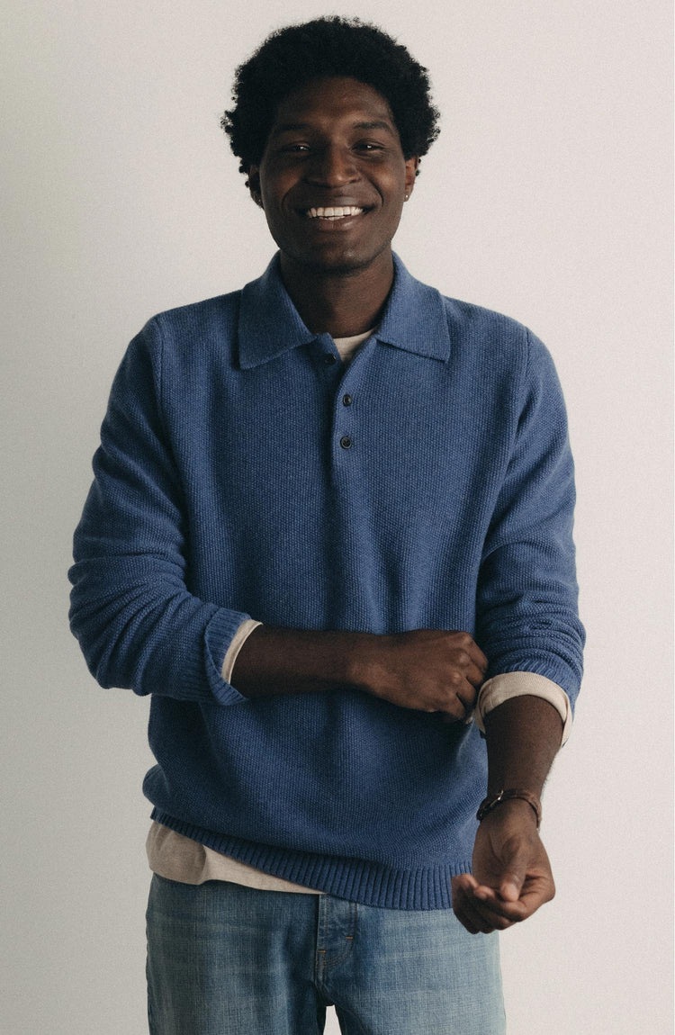 fit model posing in The Newton Sweater Polo in Heather Clear Blue