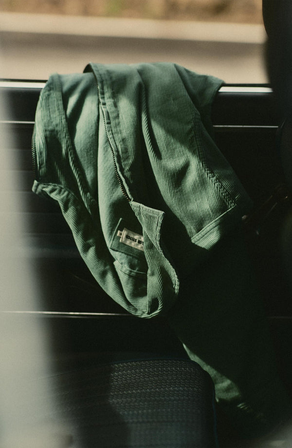 editorial image of The Piston Jacket in Ivy Corduroy on a car