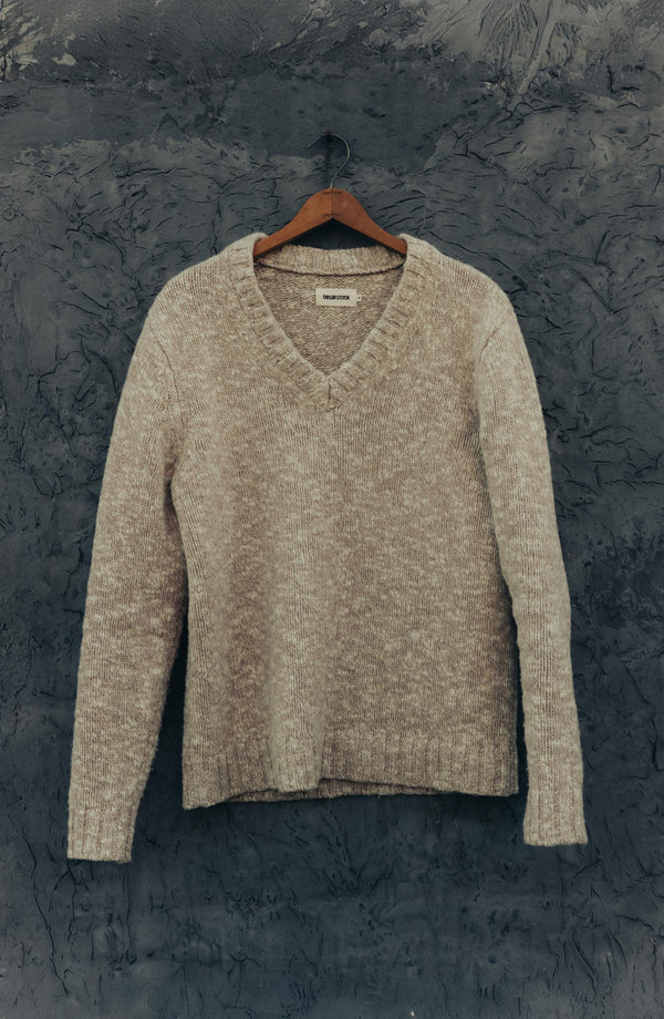 editorial image of The Match V-Neck Sweater in Sable Merino Slub hanging
