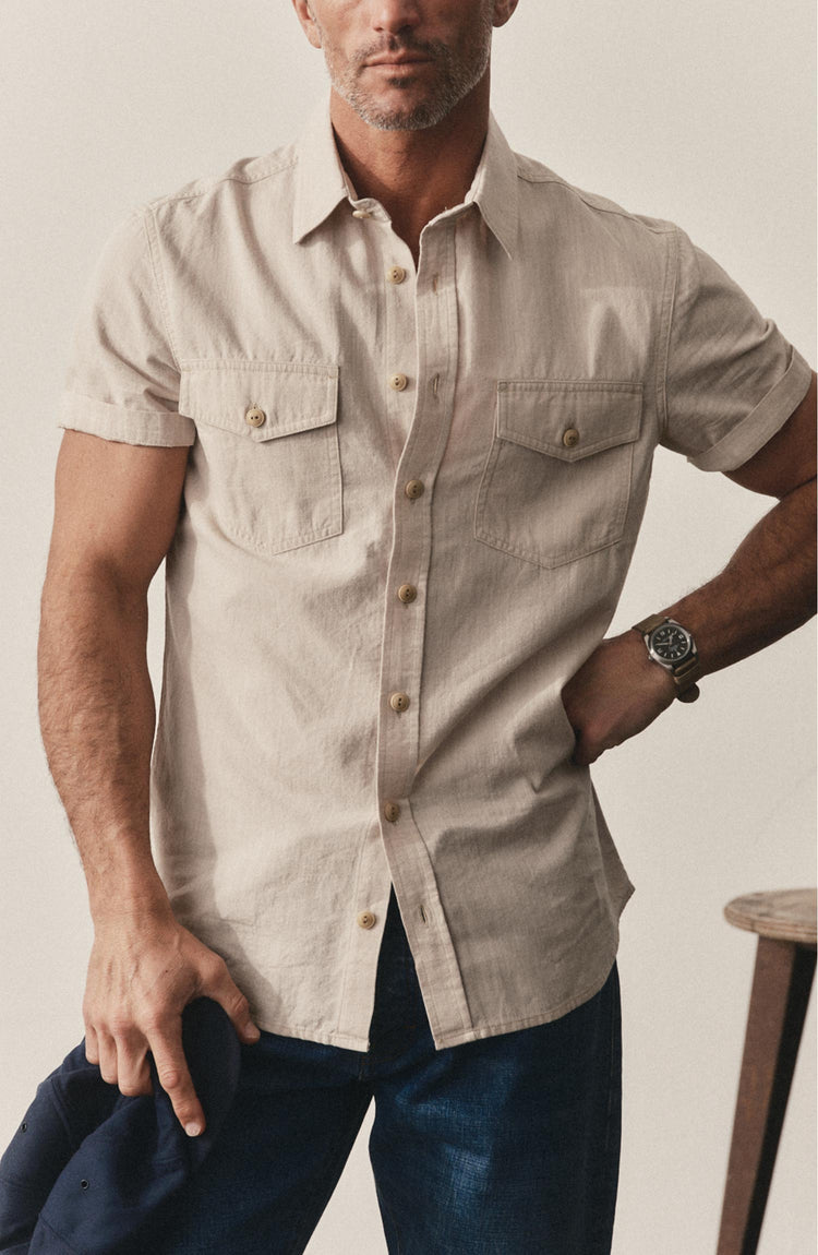 fit model posing in The Short Sleeve Crew Shirt in Natural Chambray