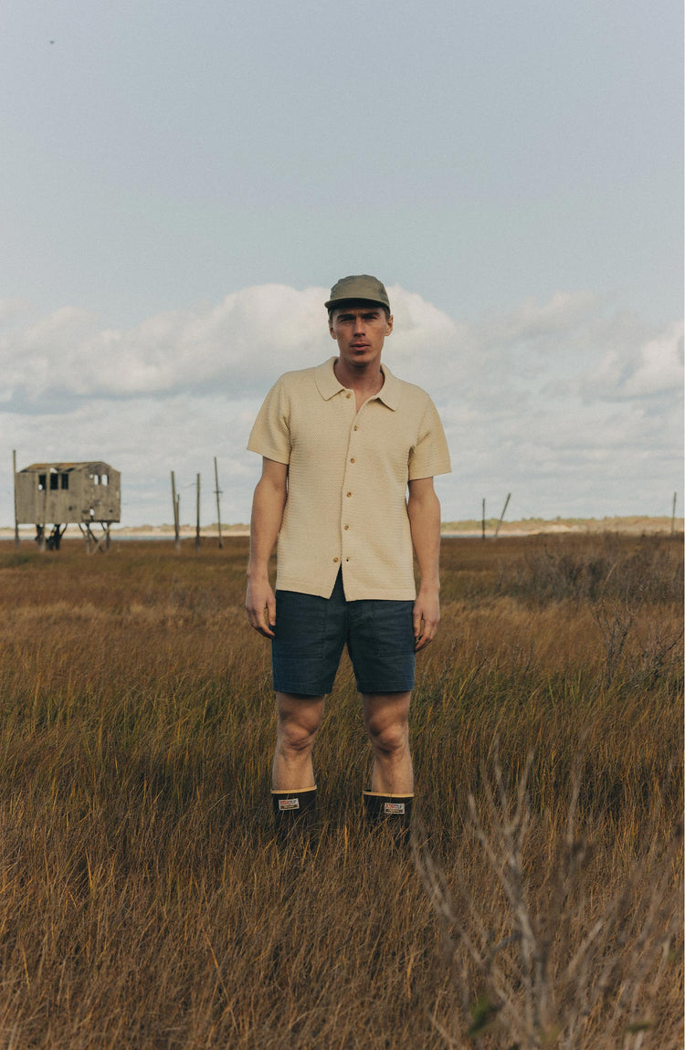 fit model posing in The Button Down Polo in Heather Oat Crochet