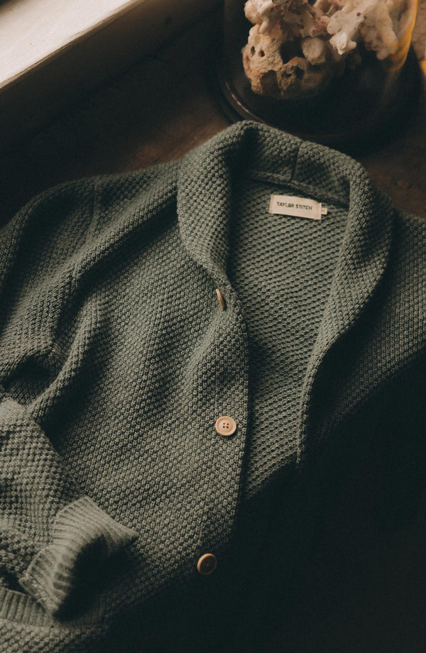editorial flatlay of  The Crawford Sweater in Deep Sea Twist
