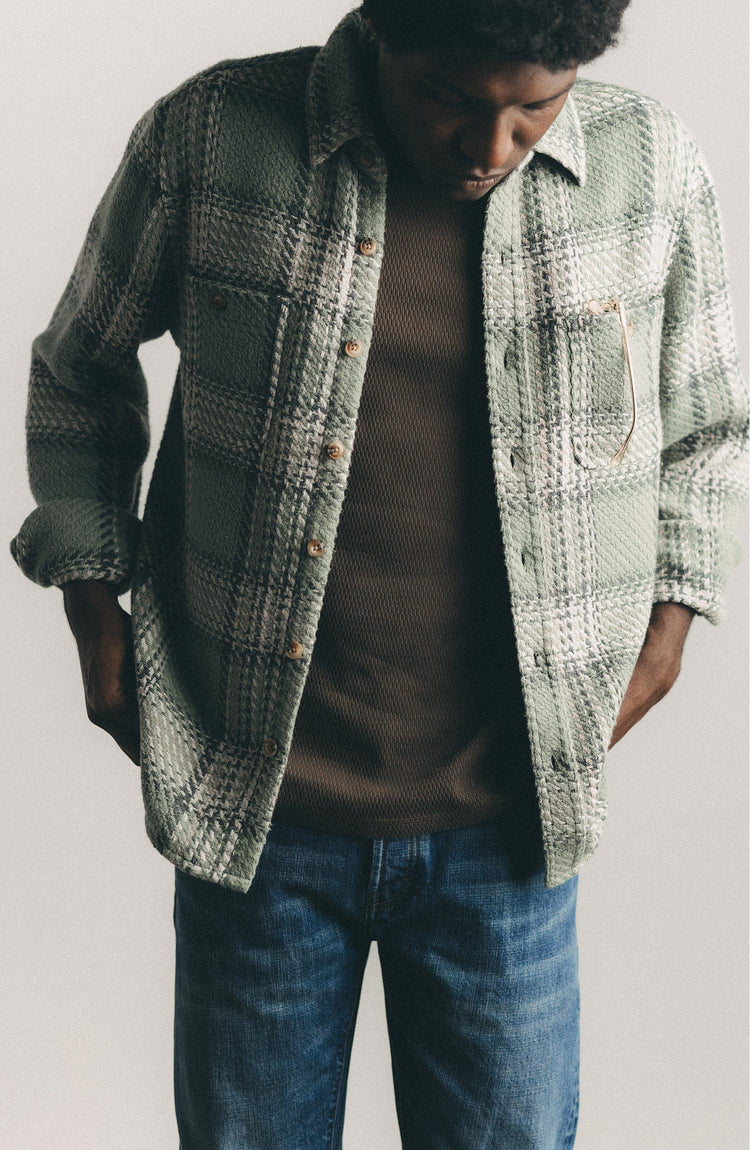 fit model posing in The Cutter Overshirt in Sage Plaid