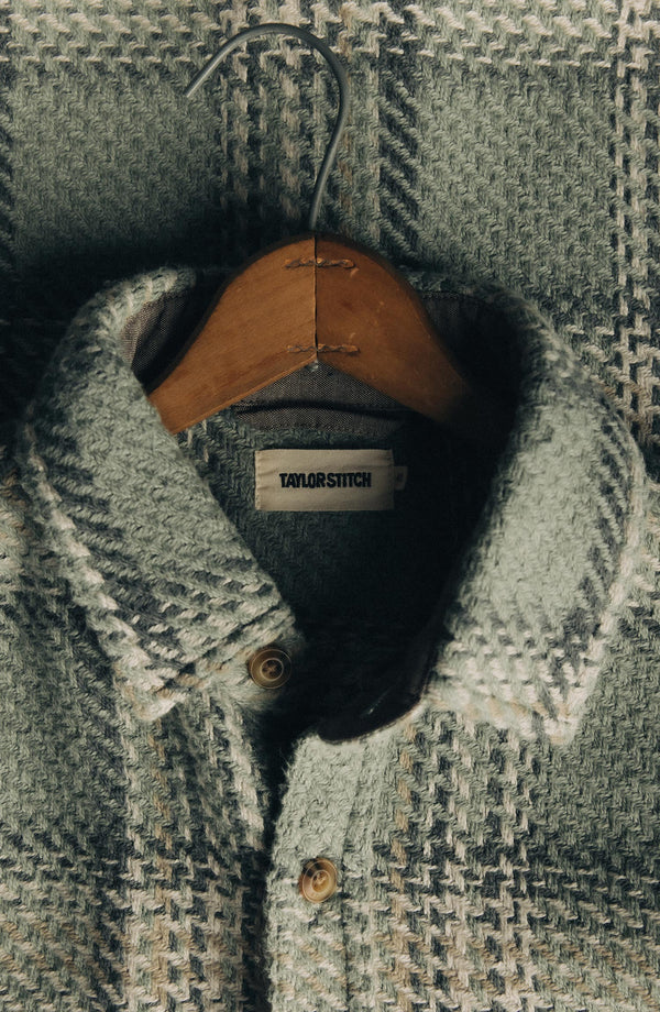editorial flatlay of The Cutter Overshirt in Sage Plaid