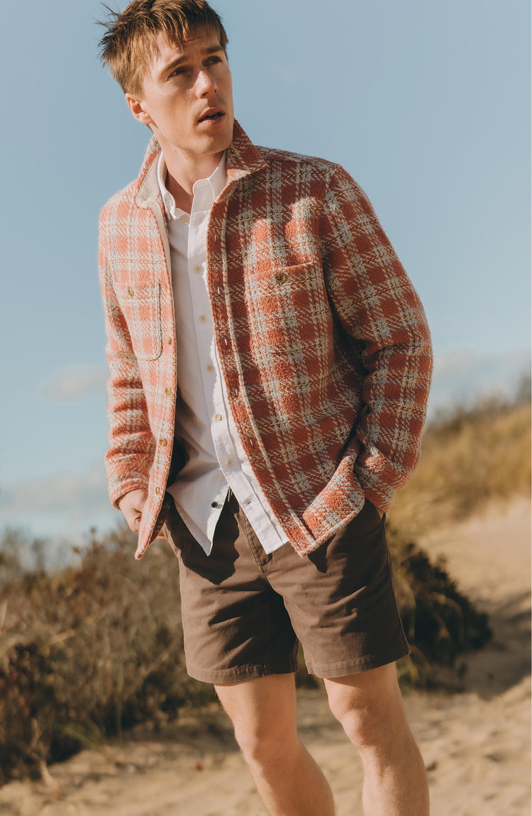 fit model posing in The Cutter Overshirt in Salmon Plaid
