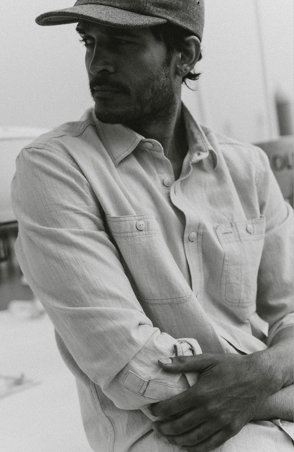 fit model posing in The Foundry Shirt in Natural Chambray