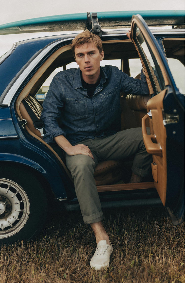 fit model posing in The Foundry Shirt in Rinsed Indigo Chambray