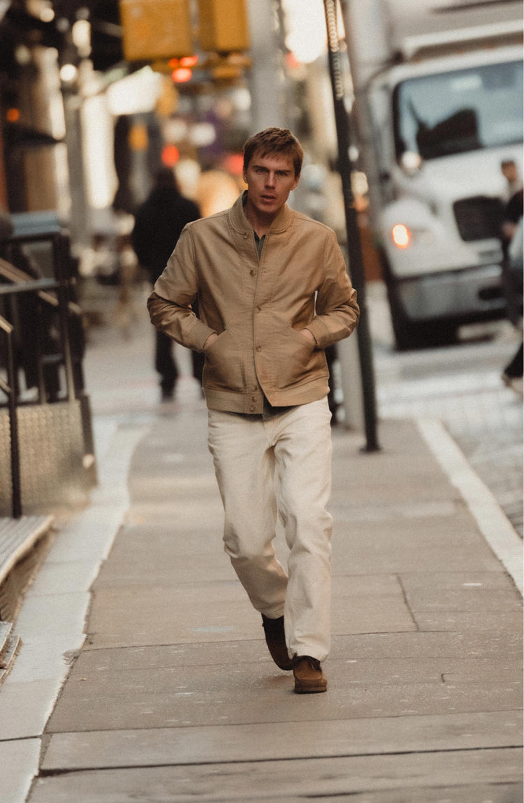 fit model walking wearing The Painter Pant in Seeded Natural Chipped Canvas