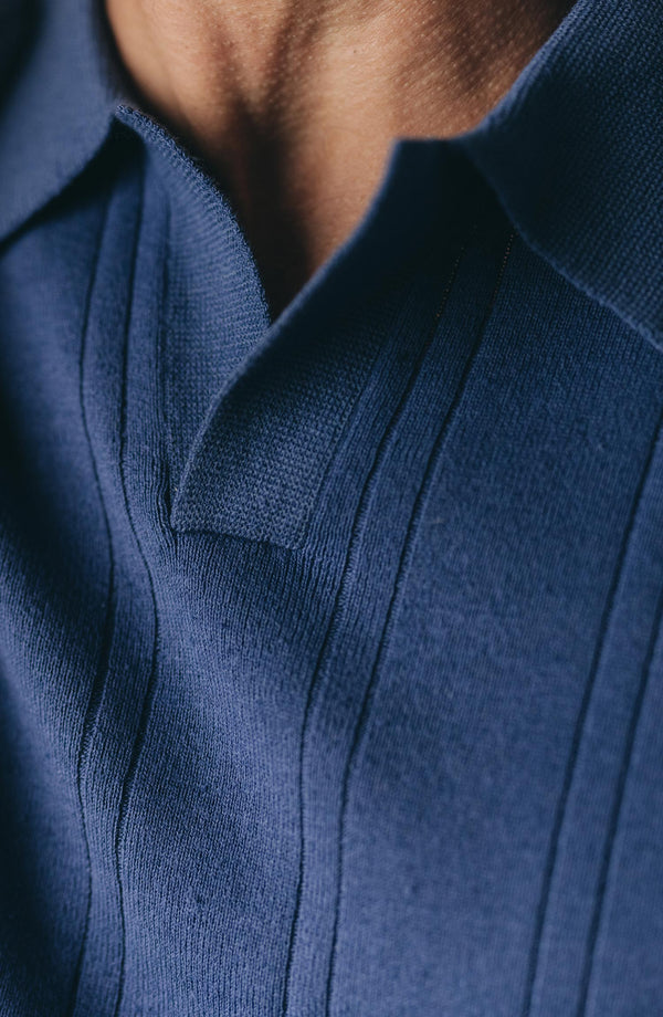 fit model showing off the collar on The Valencia Sweater Polo in Heather Clear Blue Rib