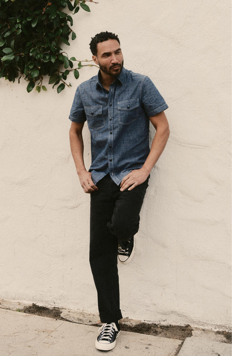 fit model posing in The Short Sleeve Crew Shirt in Washed Indigo Chambray