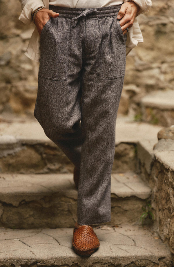 fit model walking wearing The Breakwater Pant in Grey Marl Hemp