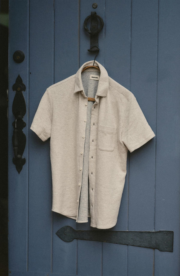 editorial image of The Short Sleeve California in Heather Oat Double Knit hanging