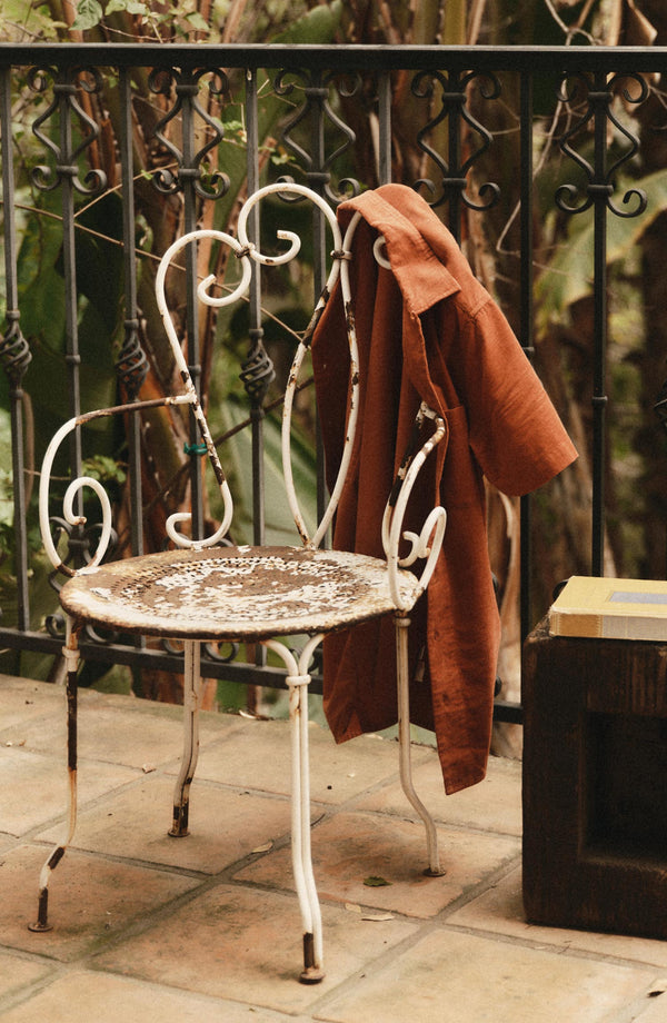 editorial image of The Conrad Shirt in Heather Chili Pincord on a chair