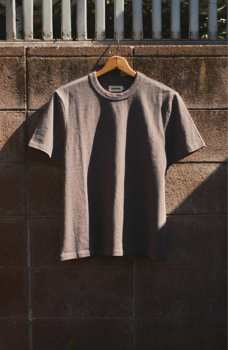 editorial image of The Organic Cotton Shop Tee in Plum Twist hanging