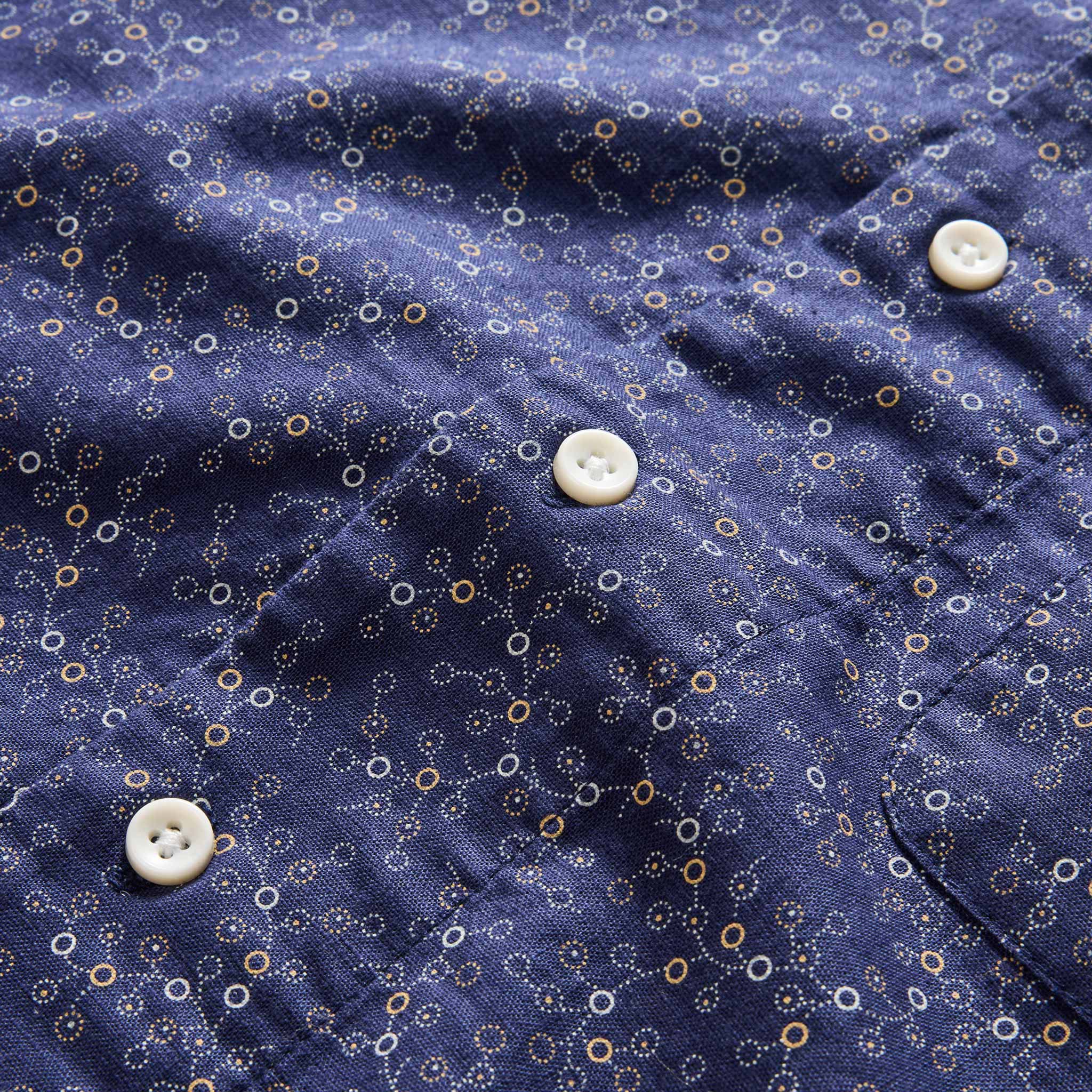 material shot of the buttons on The Short Sleeve Hawthorne in Dark Navy Floral, Wovens by Taylor Stitch