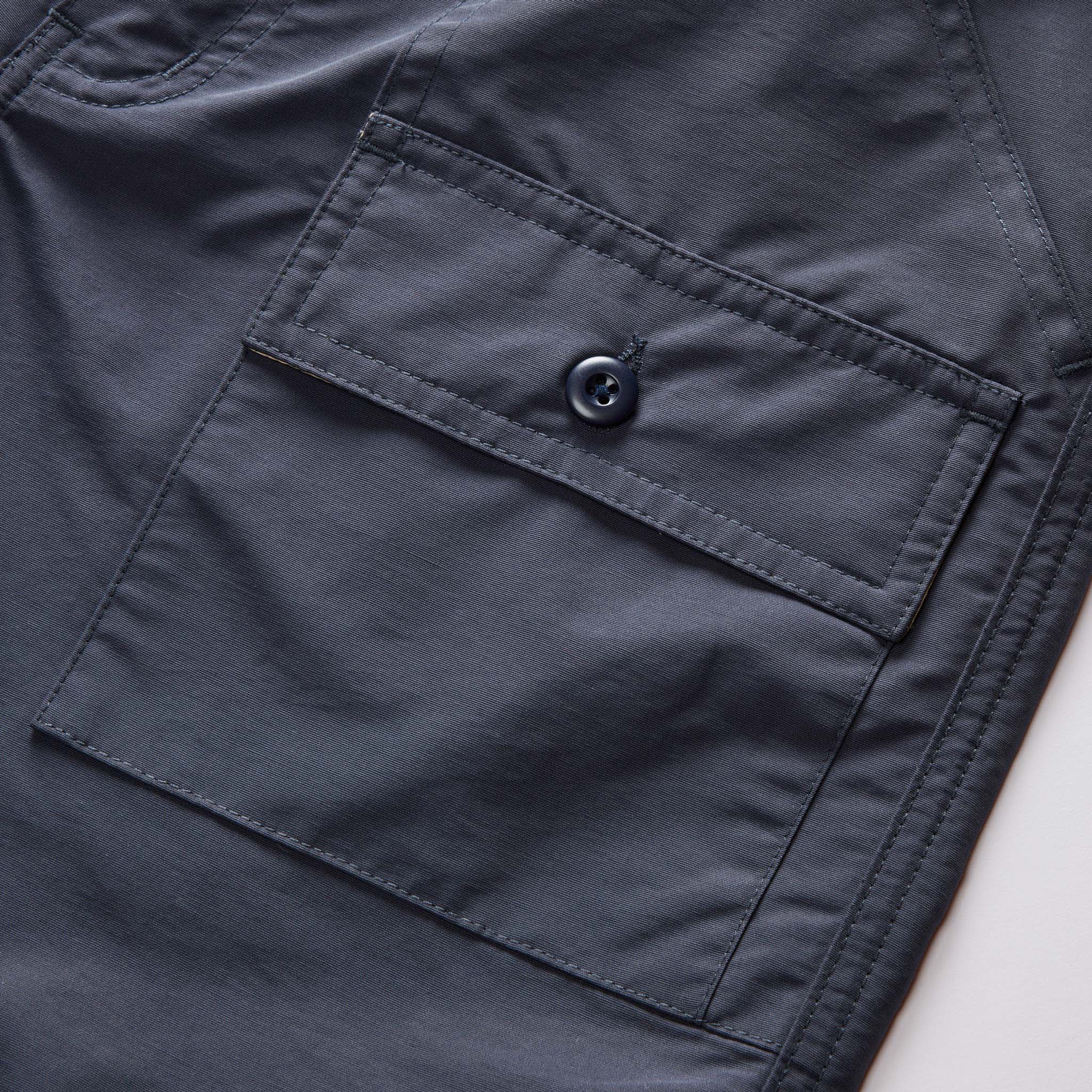 material shot of the pockets on The Trail Cargo Short in Faded Navy 60/40 Faille, Bottoms by Taylor Stitch