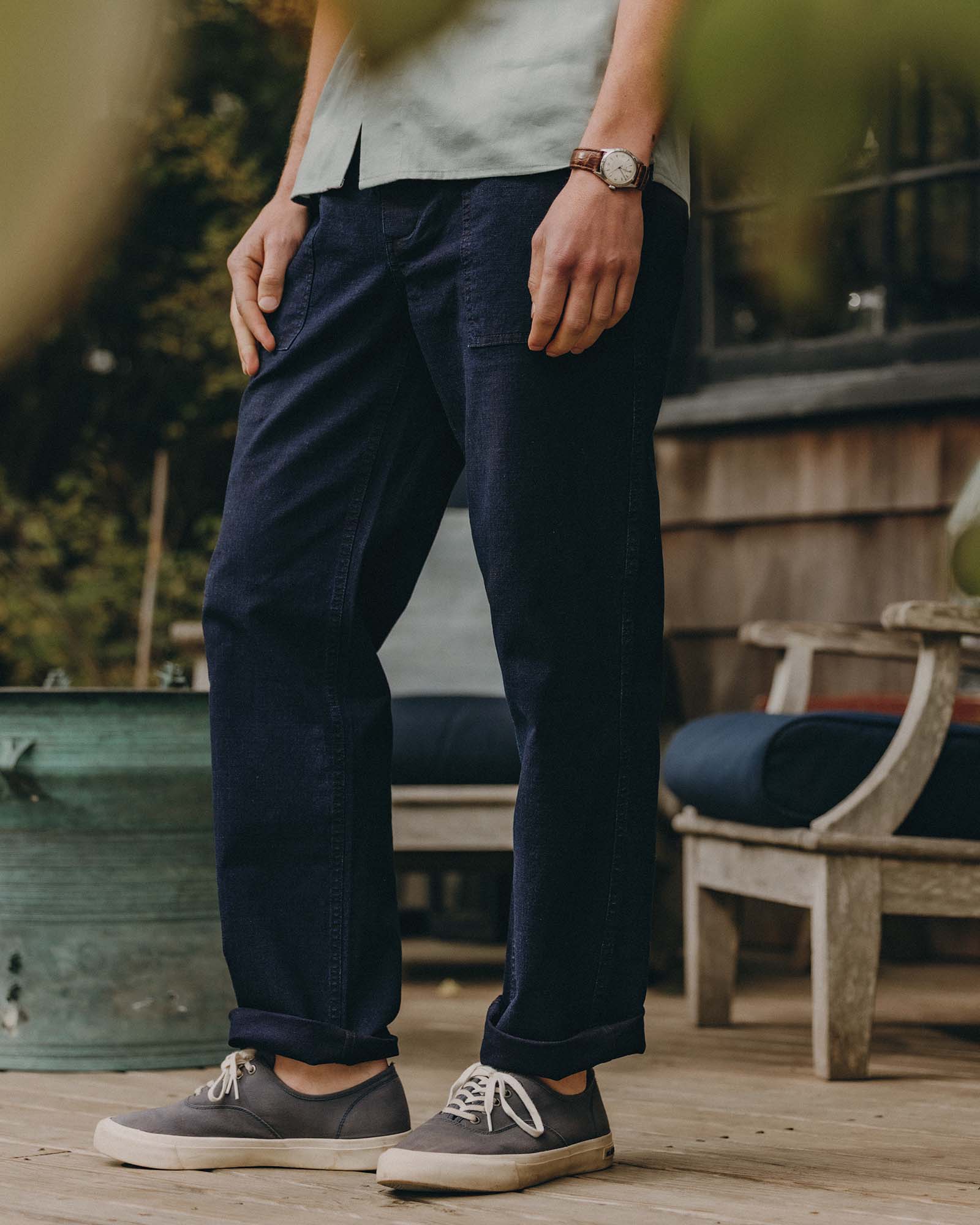 fit model posing in The Breakwater Pant in Rinsed Indigo Ripstop, Bottoms by Taylor Stitch