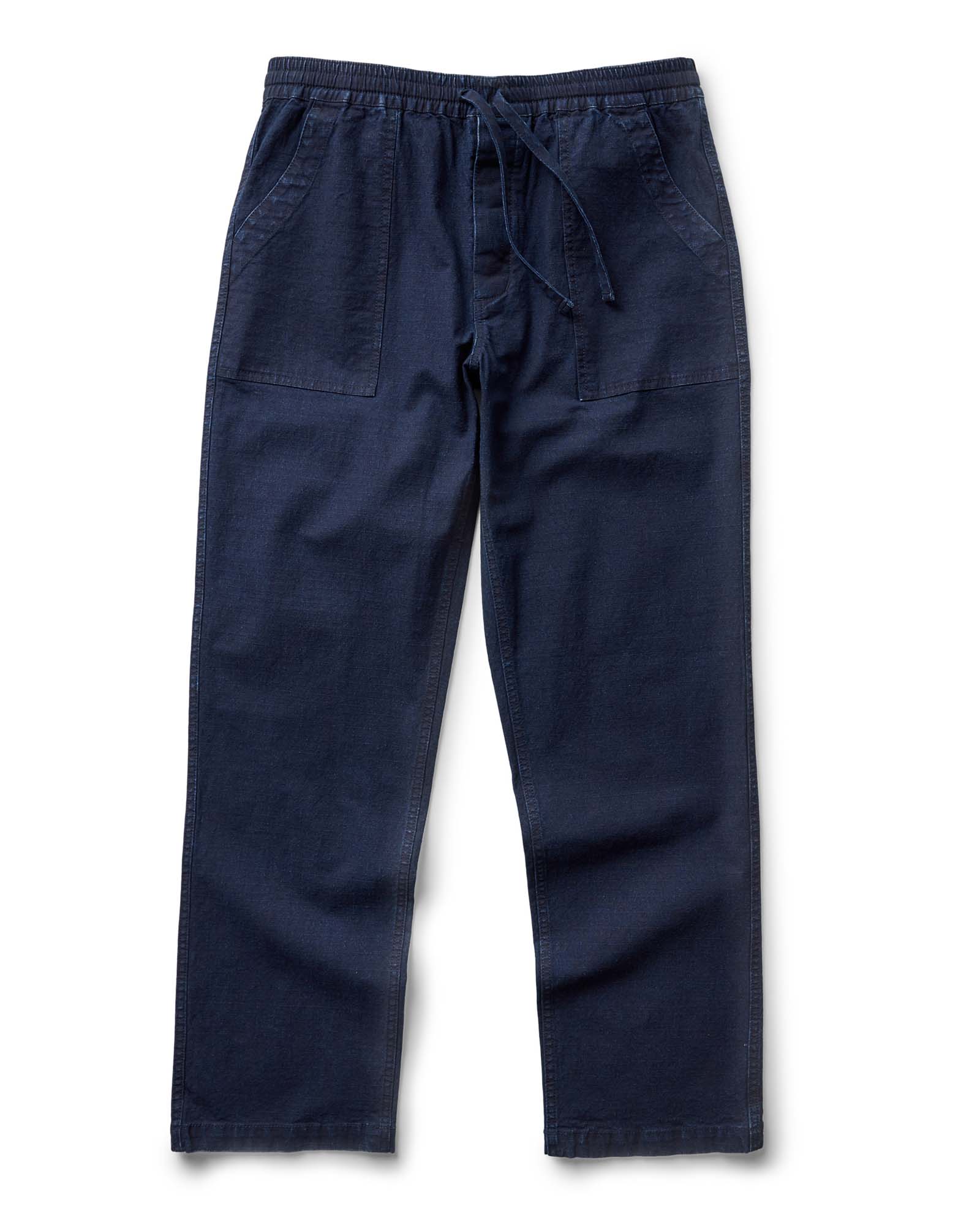 flatlay of The Breakwater Pant in Rinsed Indigo Ripstop, Bottoms by Taylor Stitch