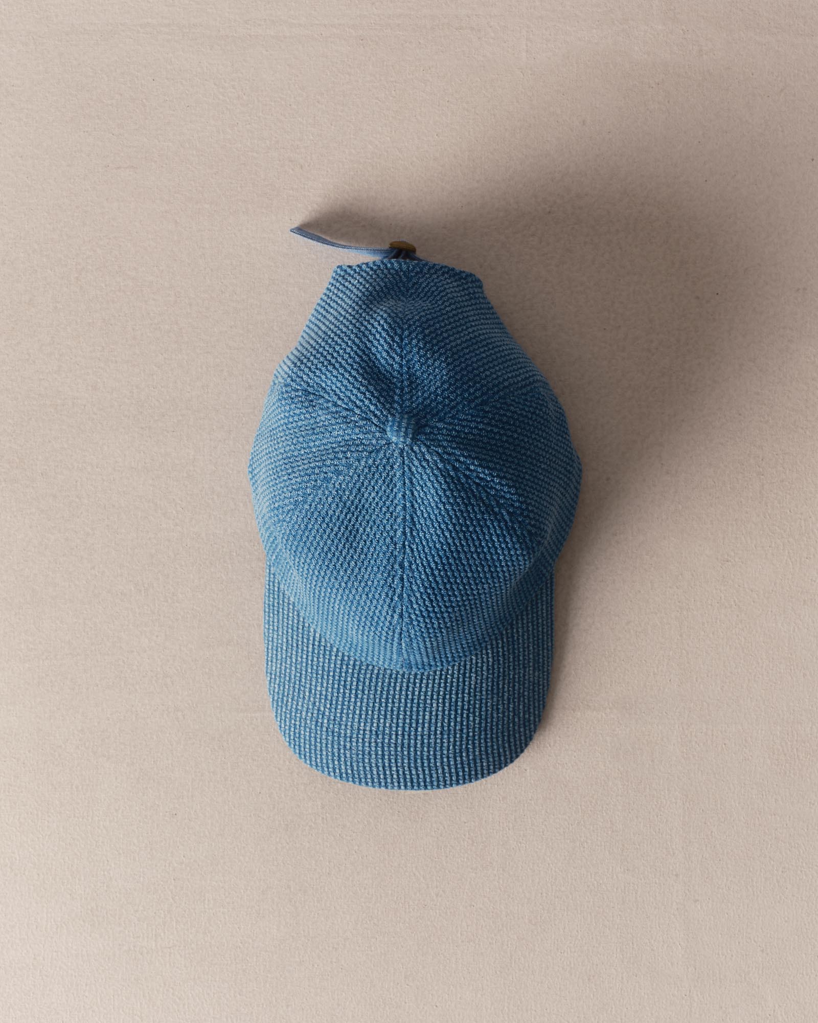 editorial image of The Taylor Stitch x Hypeadelic Cap v2.13 hanging