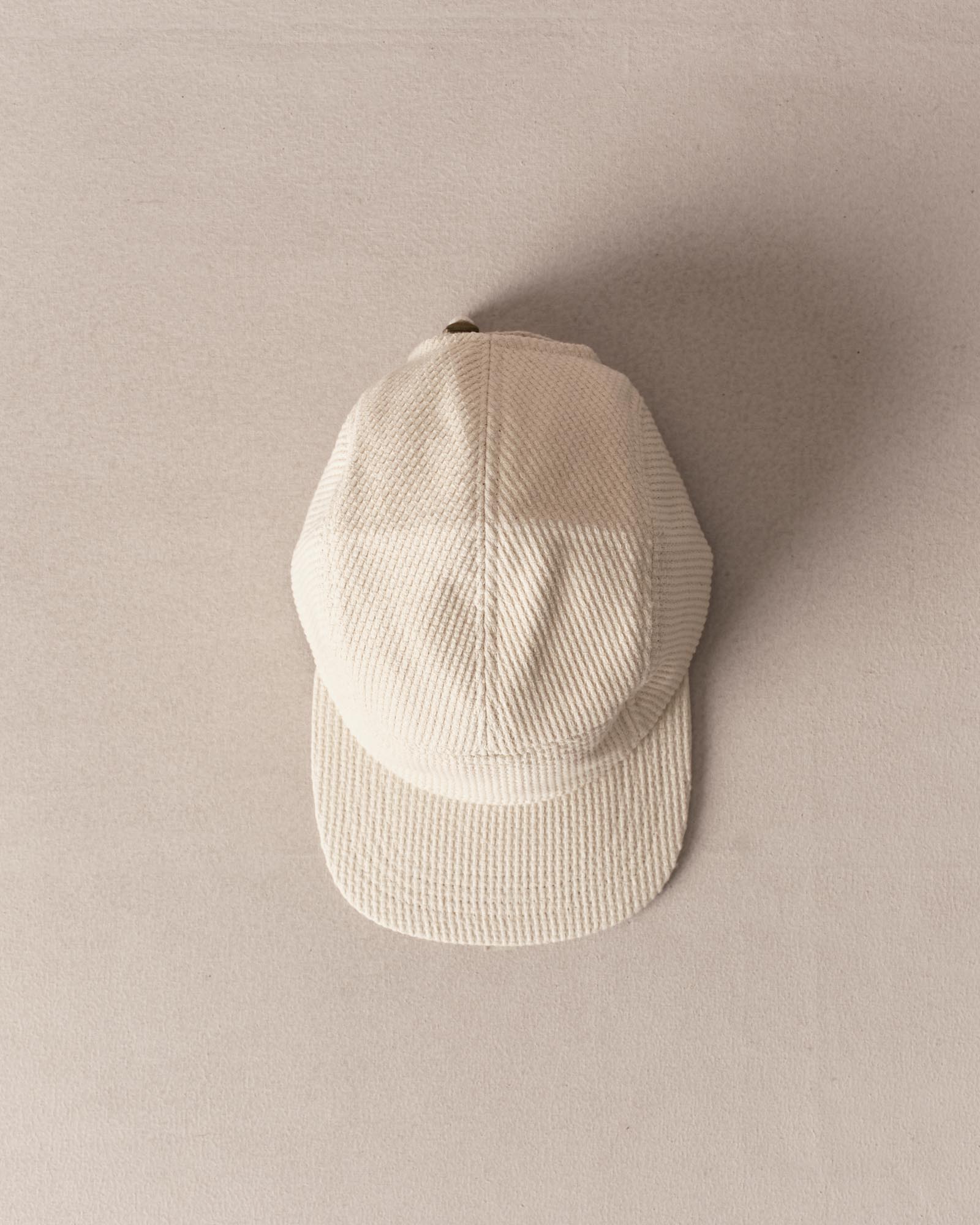 editorial image of The Taylor Stitch x Hypeadelic Cap v2.22 hanging