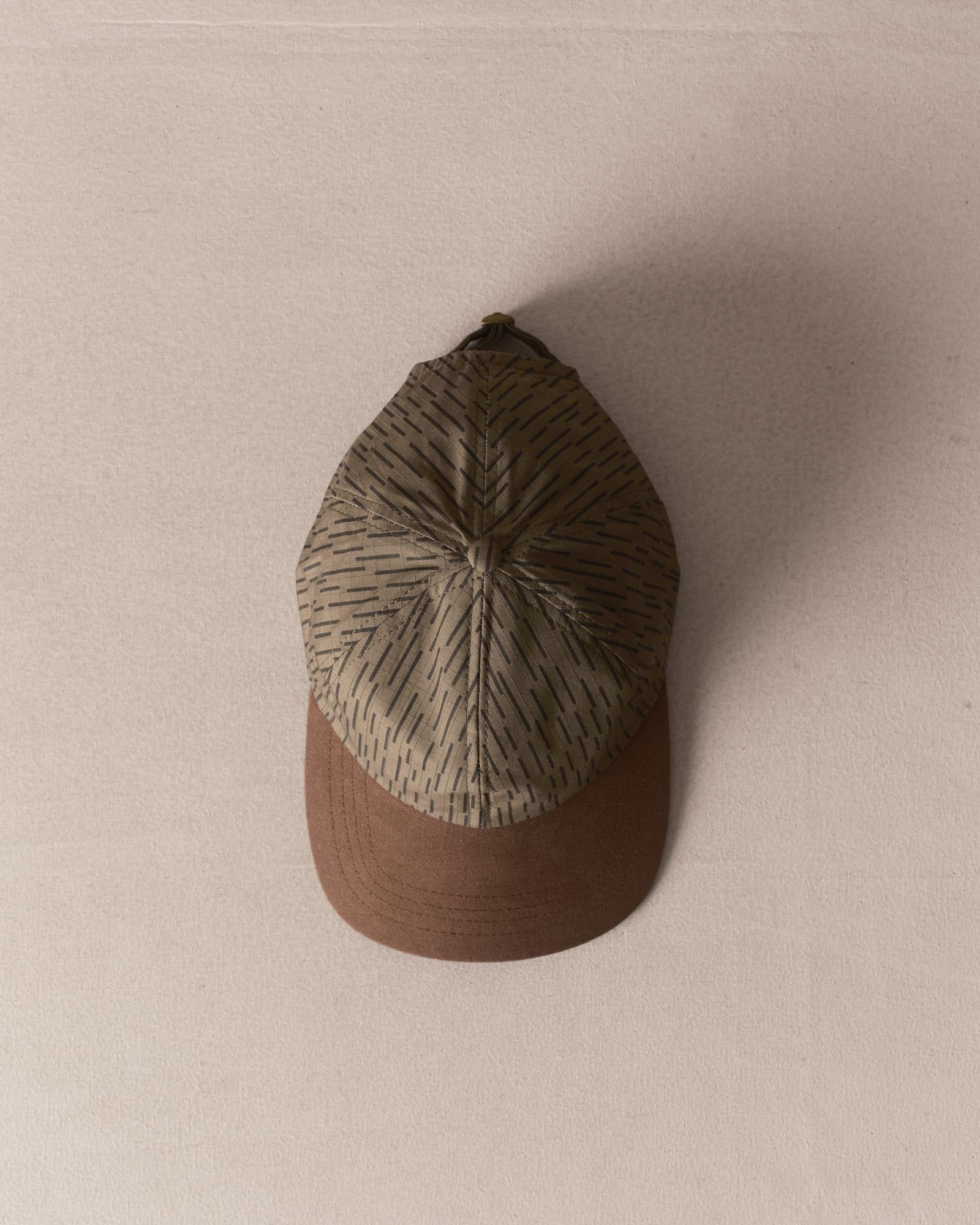editorial image of The Taylor Stitch x Hypeadelic Cap v2.30 hanging