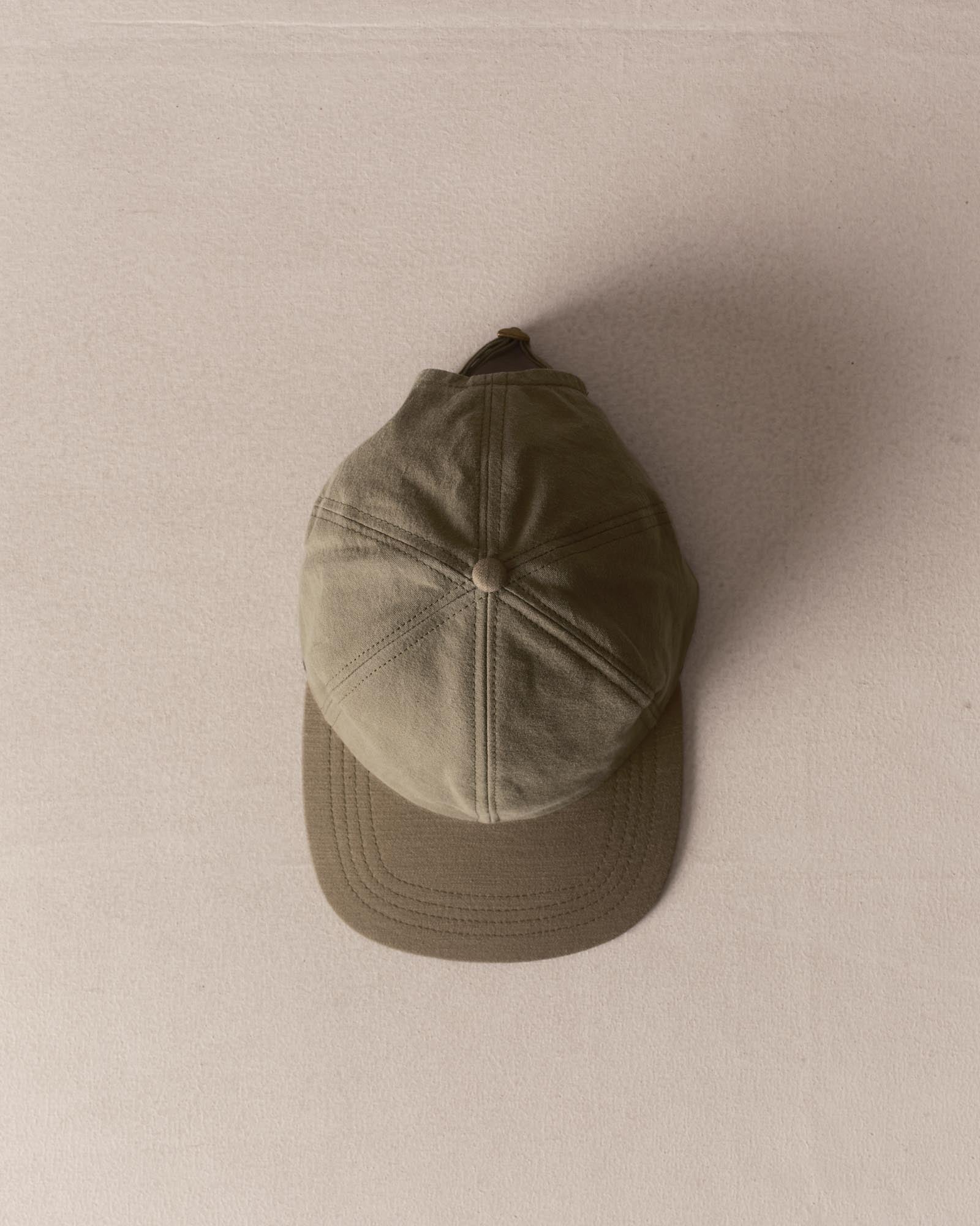 editorial image of The Taylor Stitch x Hypeadelic Cap v2.47 hanging