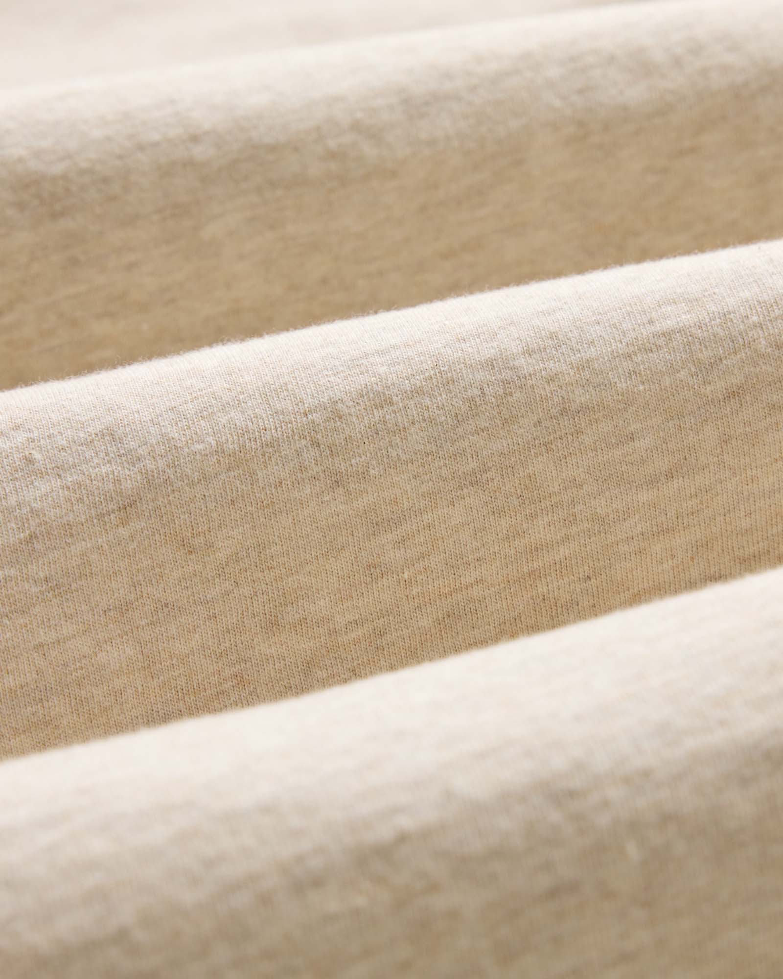 material shot of the fabric on The Organic Cotton Long Sleeve Tee in Heather Oat, Knits by Taylor Stitch