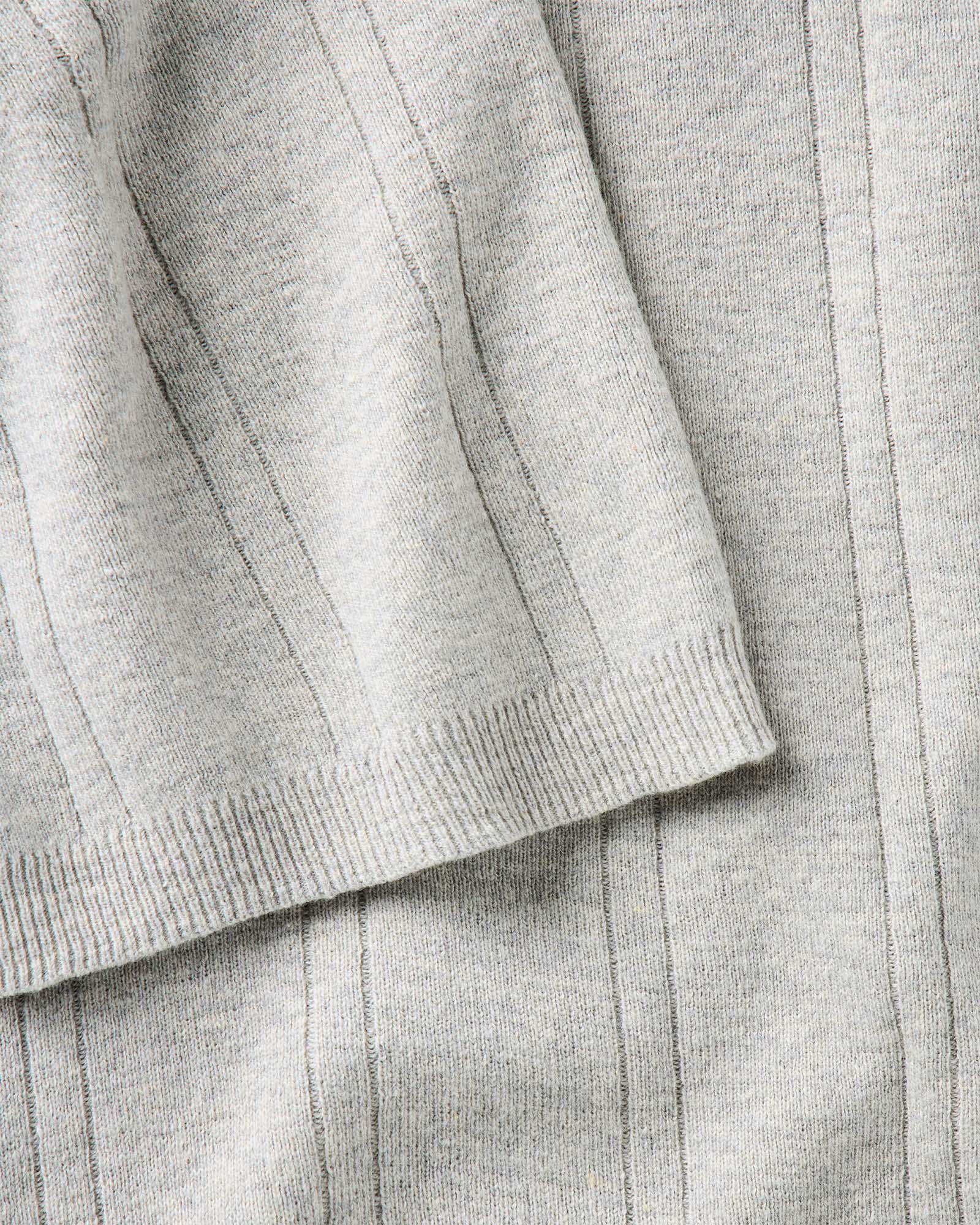 material shot of the sleeve on The Valencia Sweater Polo in Heather Grey Rib, Knits by Taylor Stitch