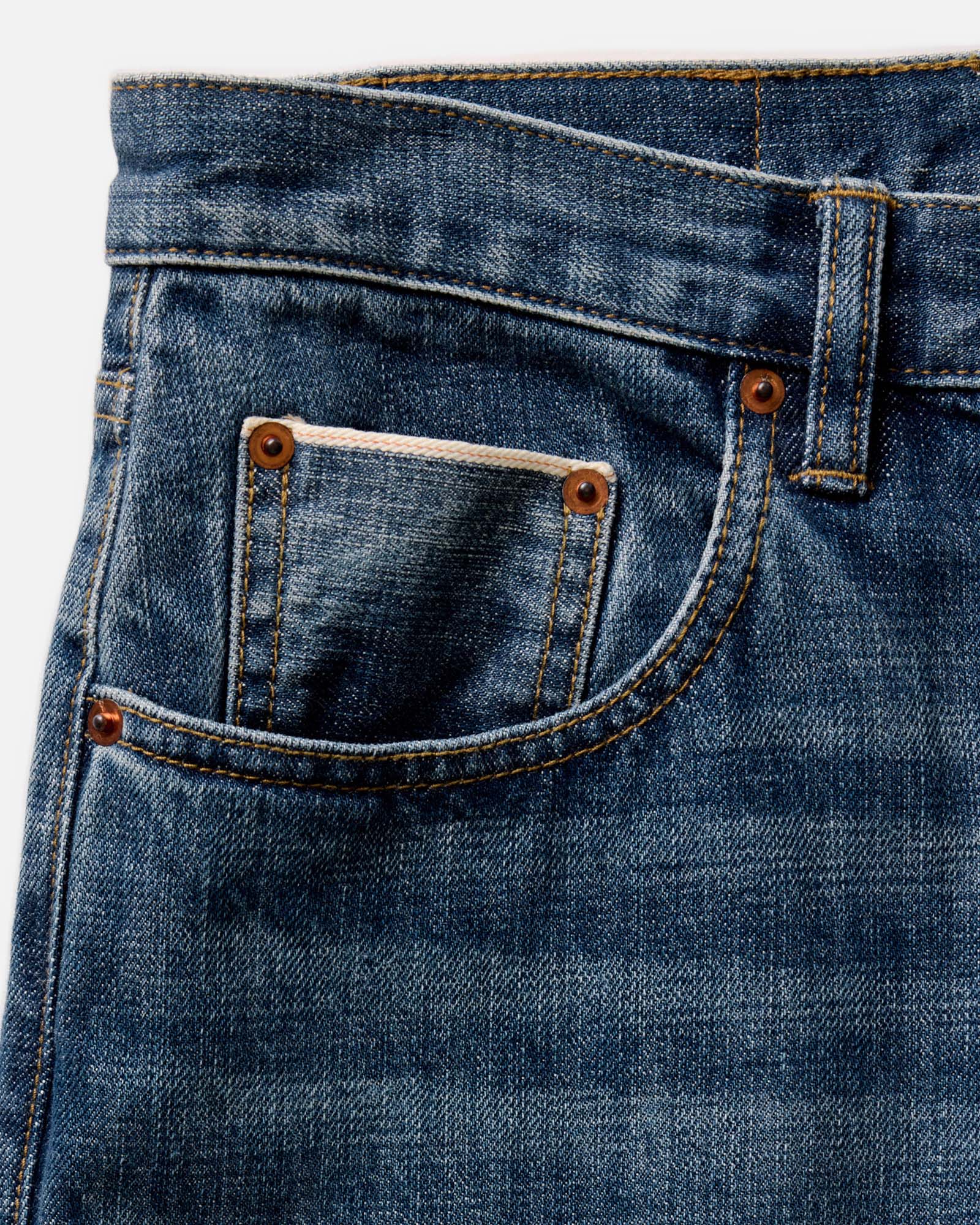 flatlay of The Slim Jean in Mid Wash Organic Selvedge, Bottoms by Taylor Stitch