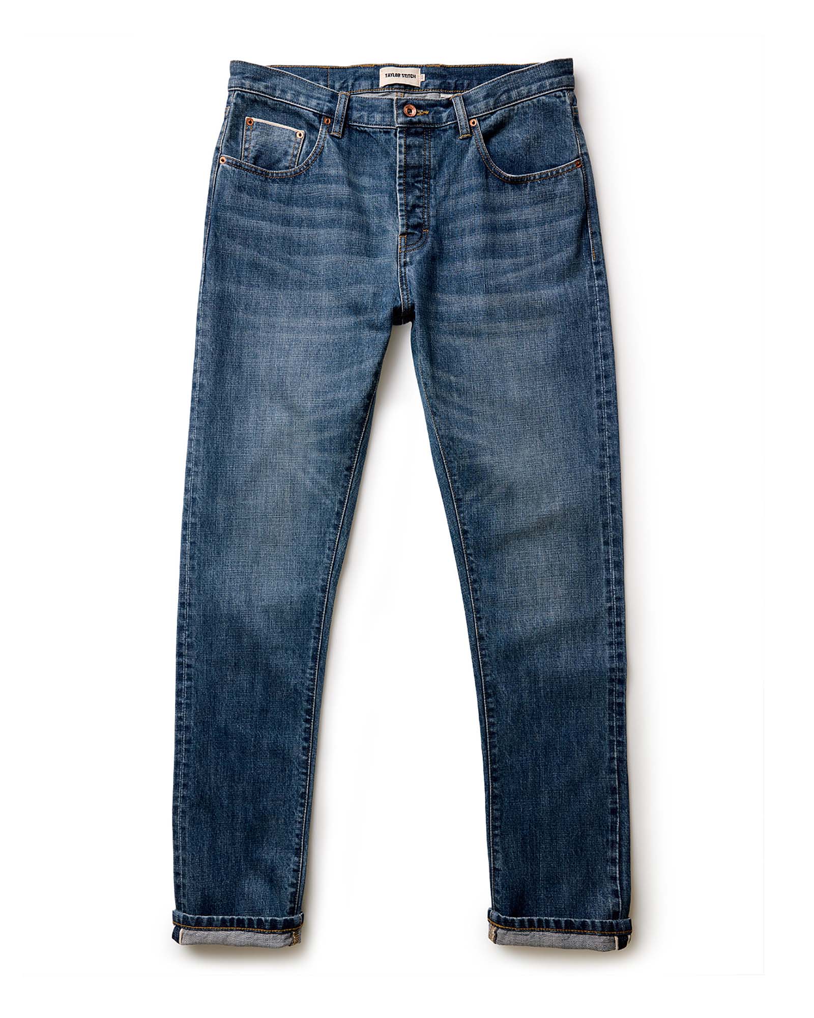 material shot of the button fly on The Slim Jean in Mid Wash Organic Selvedge, Bottoms by Taylor Stitch