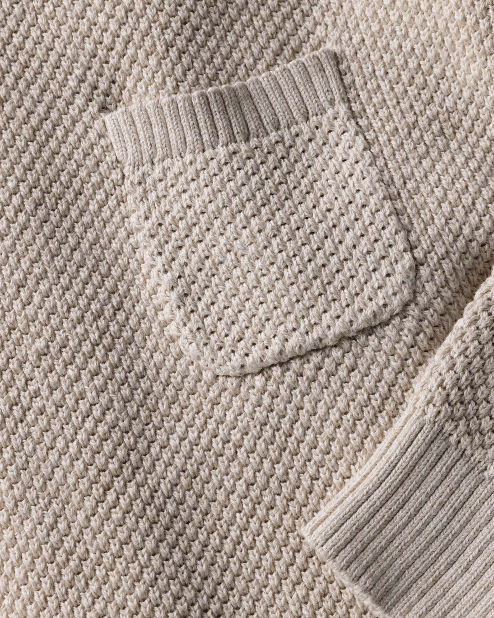 material shot of the pocket on The Crawford Crew Sweater in Marled Natural, Knits by Taylor Stitch