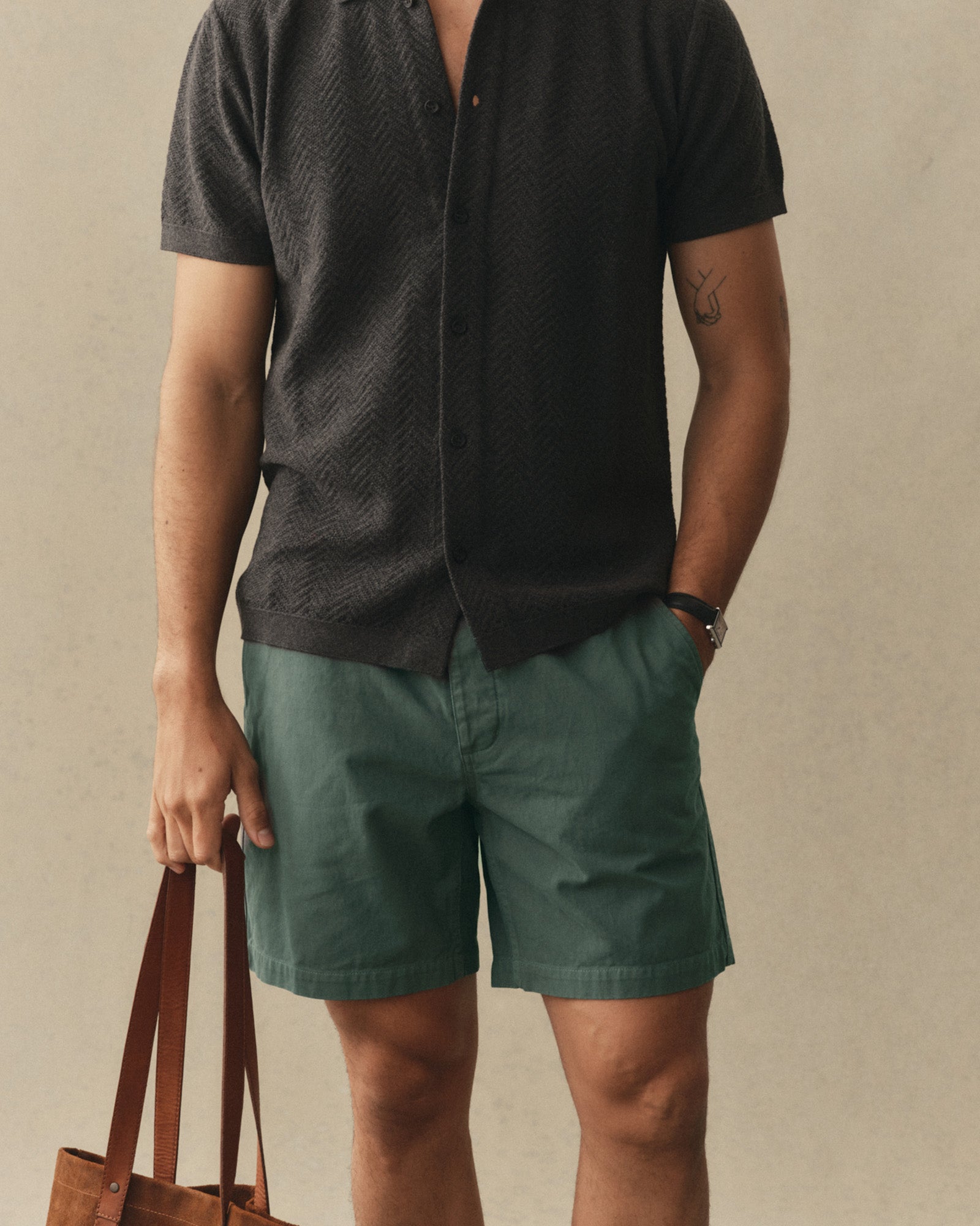 fit model posing in The Apres Short in Organic Deep Sea Foundation Twill, Bottoms by Taylor Stitch