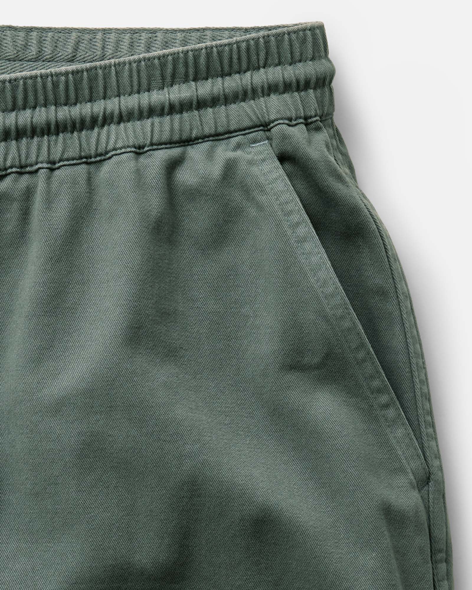 fit model sitting in The Apres Short in Organic Deep Sea Foundation Twill, Bottoms by Taylor Stitch