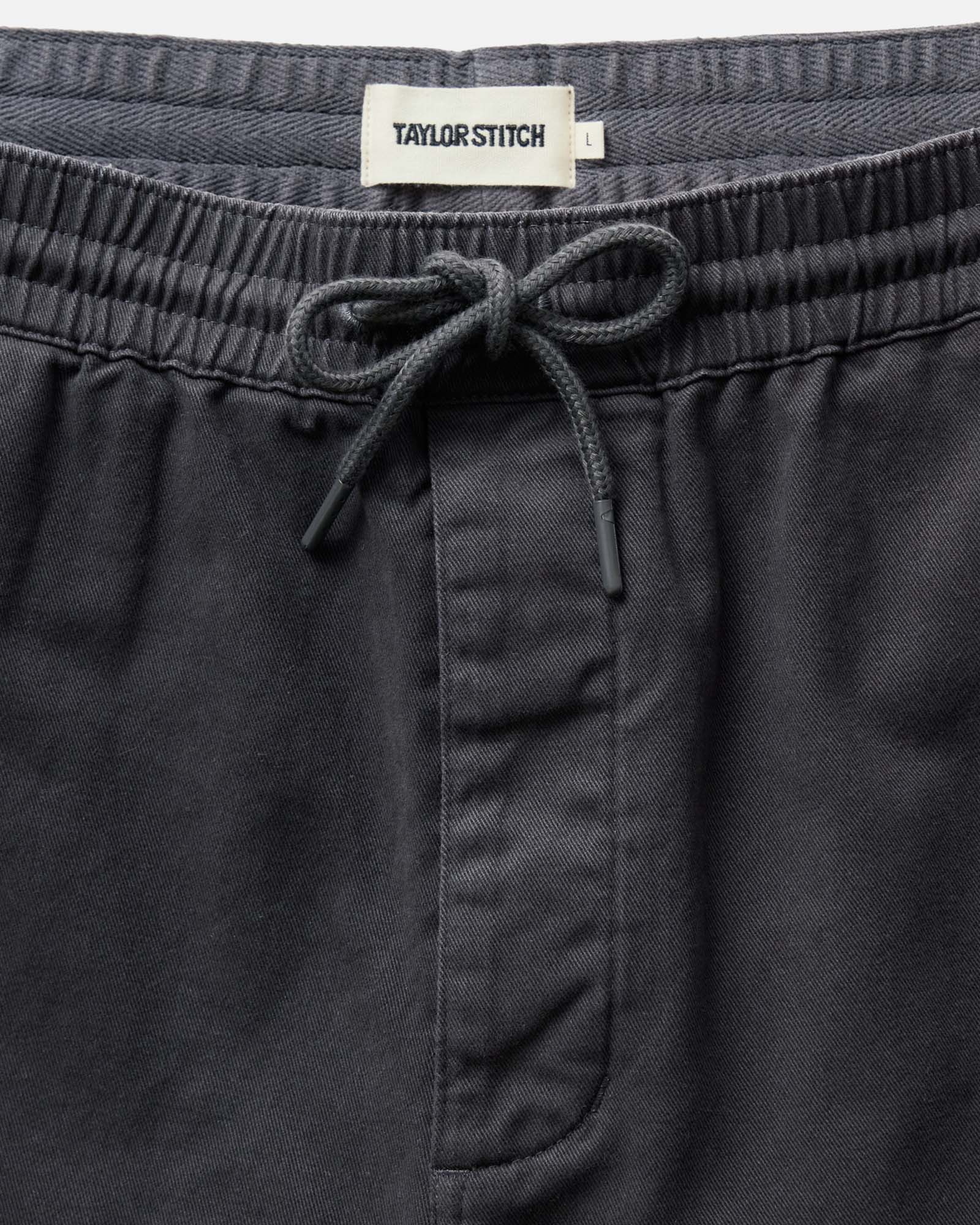 material shot of the waistband on The Apres Short in Organic Faded Black Foundation Twill, Bottoms by Taylor Stitch